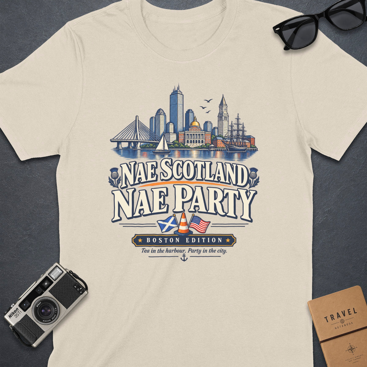 T-shirt graphic with "Nae Scotland Nae Party" text, Boston skyline, and flags.