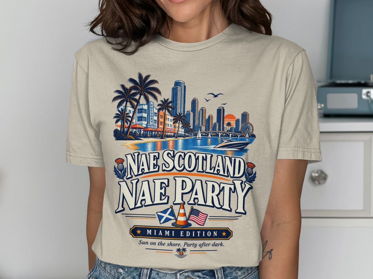 T-shirt with "Nae Scotland Nae Party" graphic, Miami skyline, palm trees, and flags.