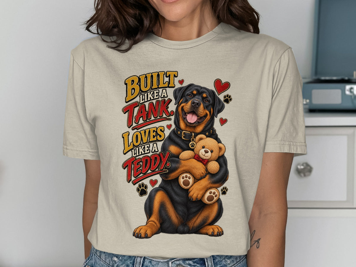 Rottweiler hugging teddy bear with text "Built Like a Tank Loves Like a Teddy".