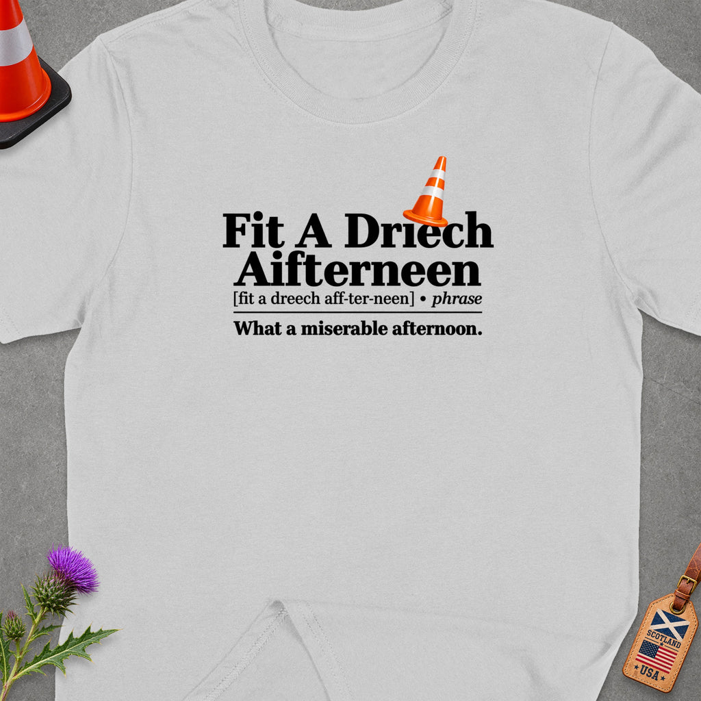 White t-shirt with orange traffic cone graphic and Scottish phrase definition.