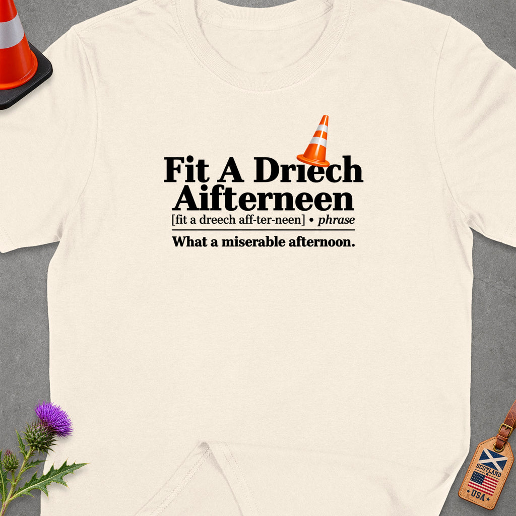 Cream t-shirt with "Fit A Driech Aifterneen" text and traffic cone graphic.