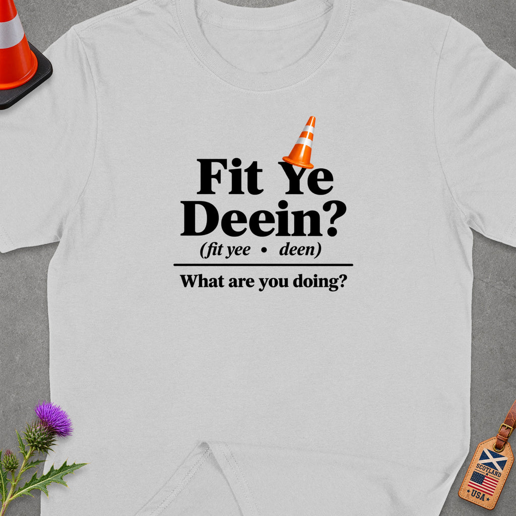T-shirt with "Fit Ye Deein? What are you doing?" text and traffic cone graphic.
