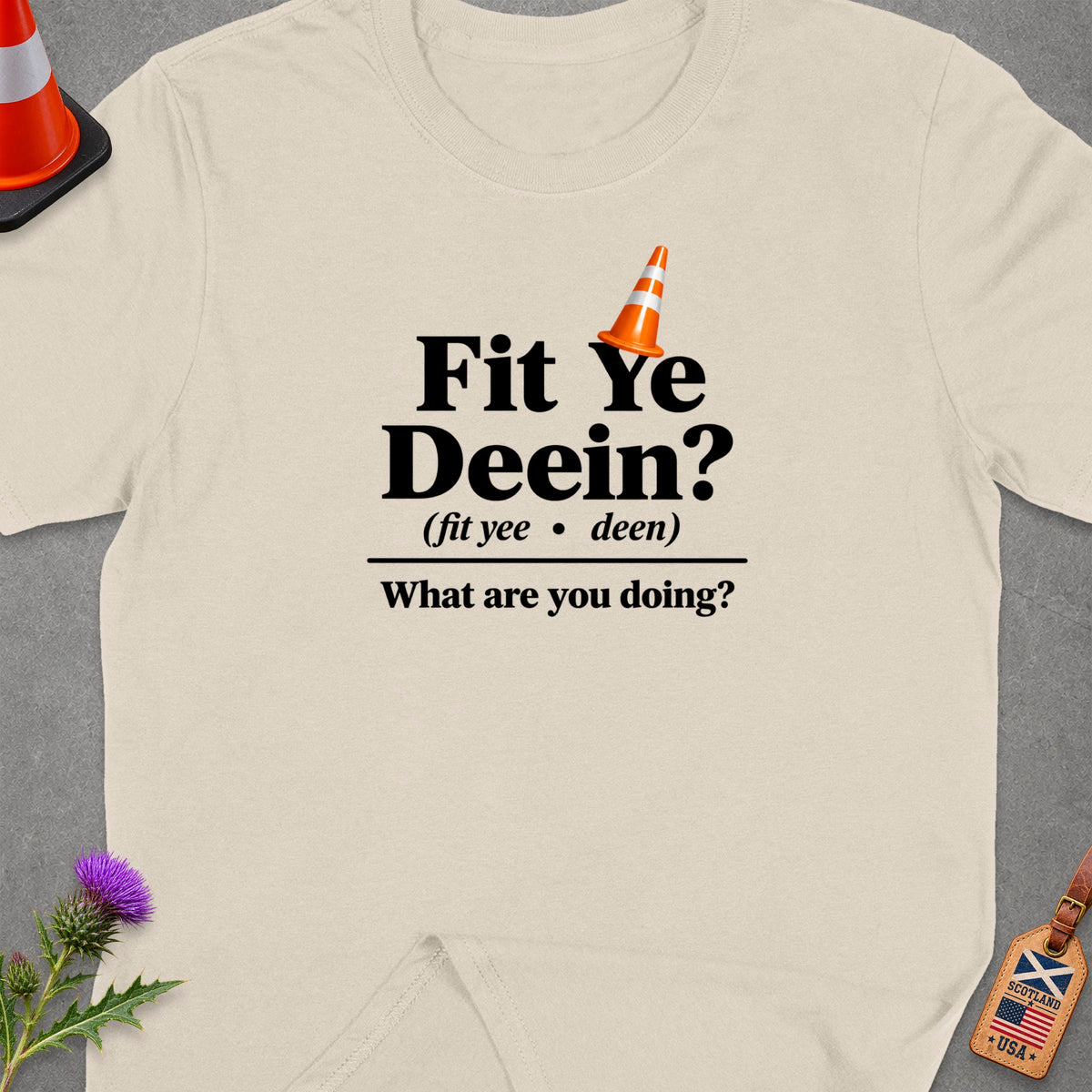 Light cream t-shirt with text "Fit Ye Deein? What are you doing?"