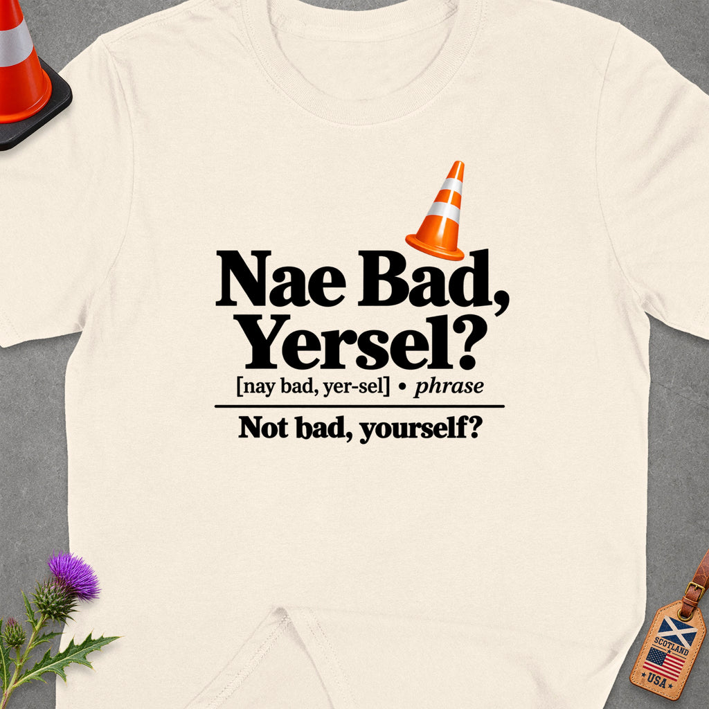 T-shirt with "Nae Bad, Yersel?" text, traffic cone, and Scotland/USA luggage tag.