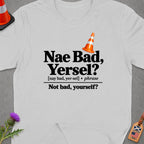 White t-shirt with black text "Nae Bad, Yersel? Not bad, yourself?" and a traffic cone.