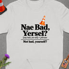White t-shirt with "Nae Bad, Yersel?" text and a traffic cone graphic.