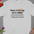 White t-shirt with Scottish phrase "Funcy A Fly Cup An A Claik?" and translation.