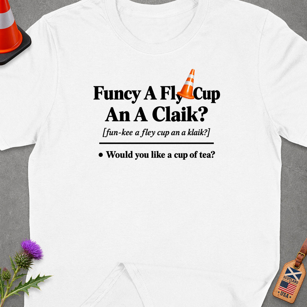 White t-shirt with text "Funcy A Fly Cup An A Claik? Would you like a cup of tea?"