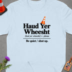 Light blue t-shirt with "Haud Yer Wheesht" and "Be quiet / shut up." text.