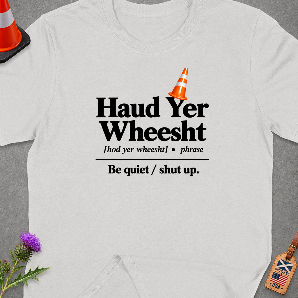 White t-shirt with "Haud Yer Wheesht" and "Be quiet / shut up." text.