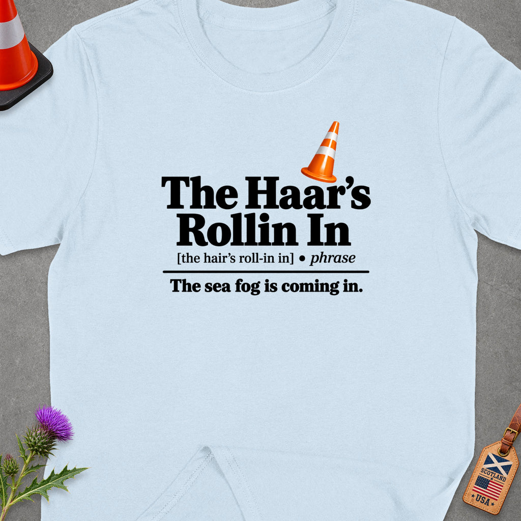 Light blue t-shirt with "The Haar's Rollin In" text and traffic cone.