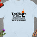 Light blue t-shirt with "The Haar's Rollin In" text and traffic cone.
