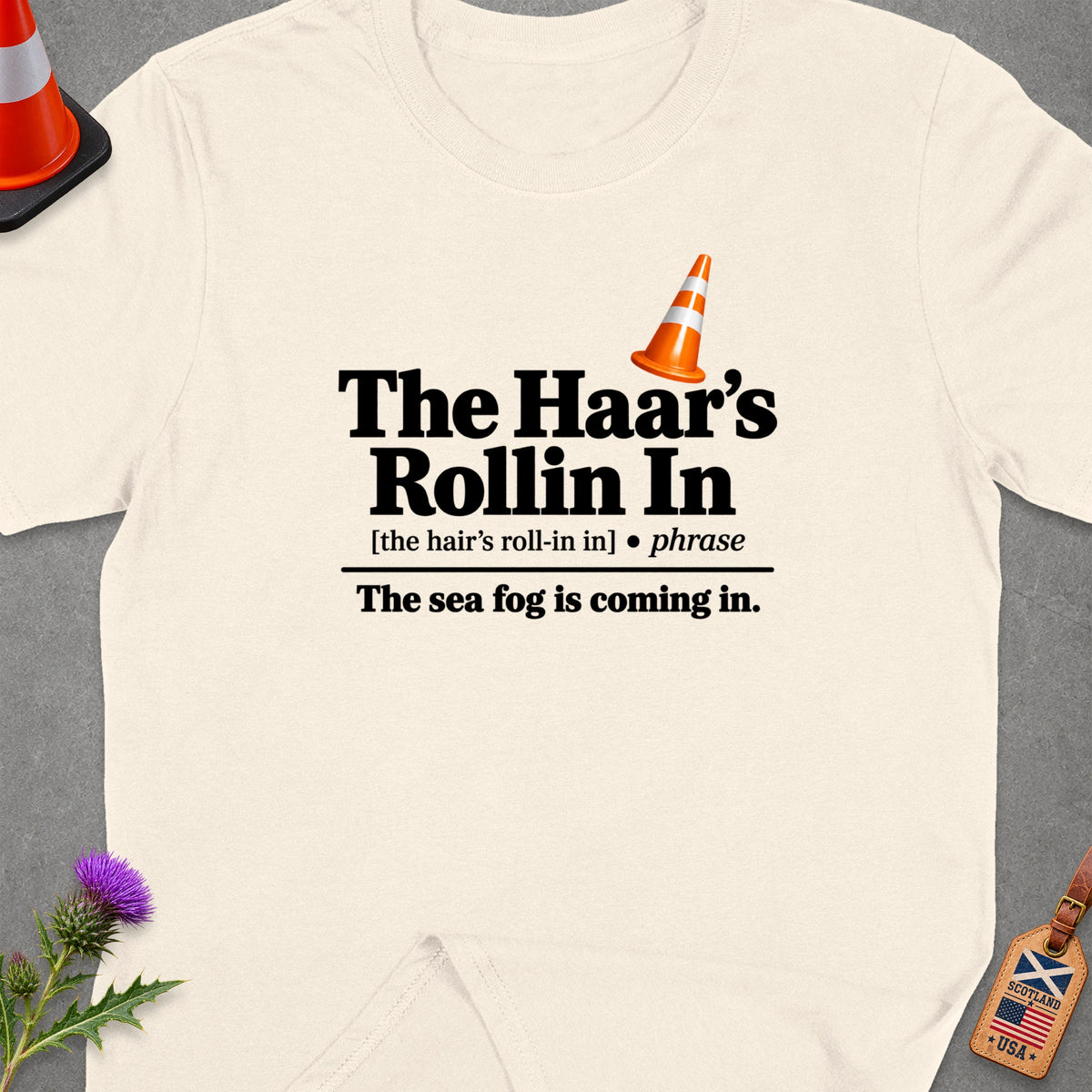 Cream t-shirt with "The Haar's Rollin In" and "The sea fog is coming in." text.
