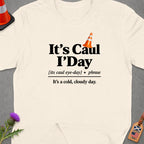 Cream t-shirt with "It's Caul I'Day" and definition "It's a cold, cloudy day."