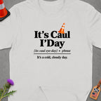 White t-shirt with "It's Caul I'Day" text and a traffic cone graphic.