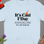 Light blue t-shirt with black text "It's Caul I'Day" and a definition.
