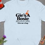 Light blue t-shirt with "Gie's A Bosie" and "Give me a hug." text.