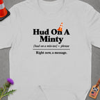Light grey t-shirt with "Hud On A Minty" text and traffic cone graphic.