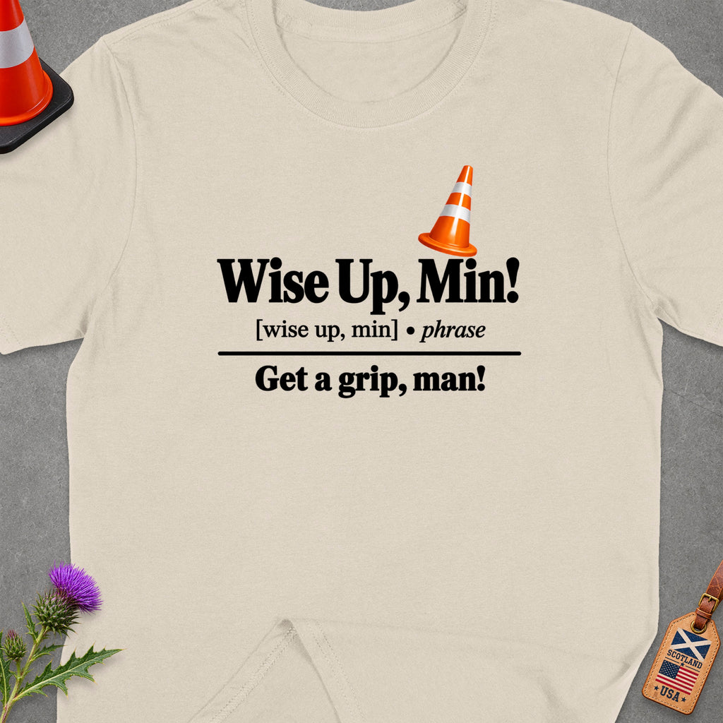 Cream t-shirt with "Wise Up, Min!" and "Get a grip, man!" text.