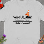 White t-shirt with black text "Wise Up, Min!" and "Get a grip, man!".