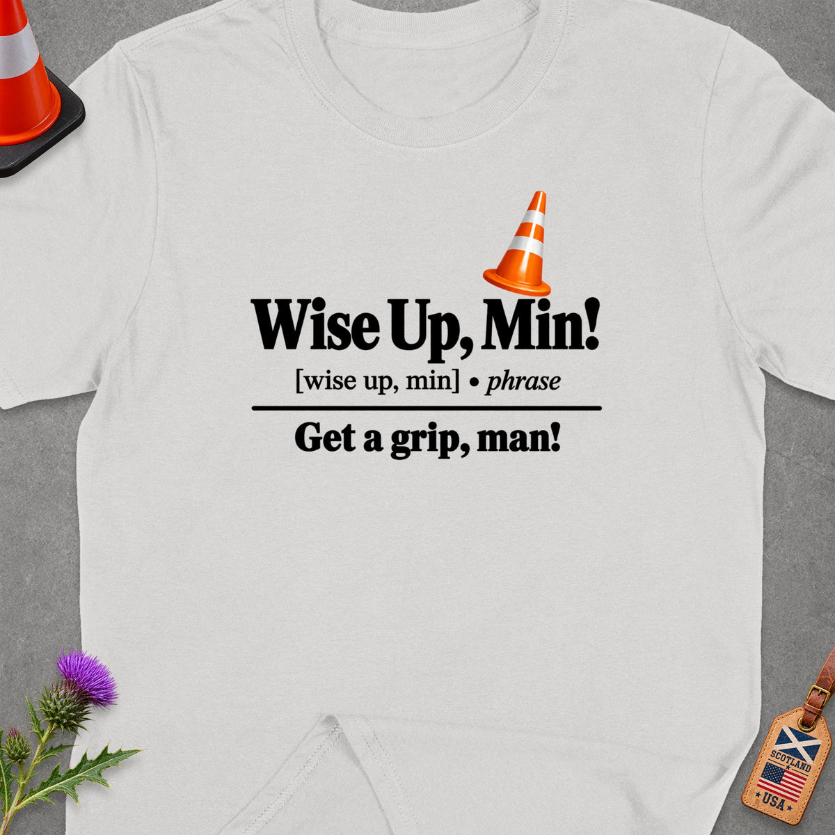 White t-shirt with "Wise Up, Min!" and "Get a grip, man!" text.
