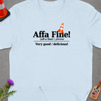 Light blue t-shirt with text "Affa Fine! Very good / delicious!" and orange traffic cone icon.