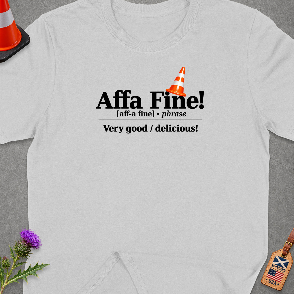 White t-shirt with "Affa Fine!" phrase definition and traffic cone graphic.