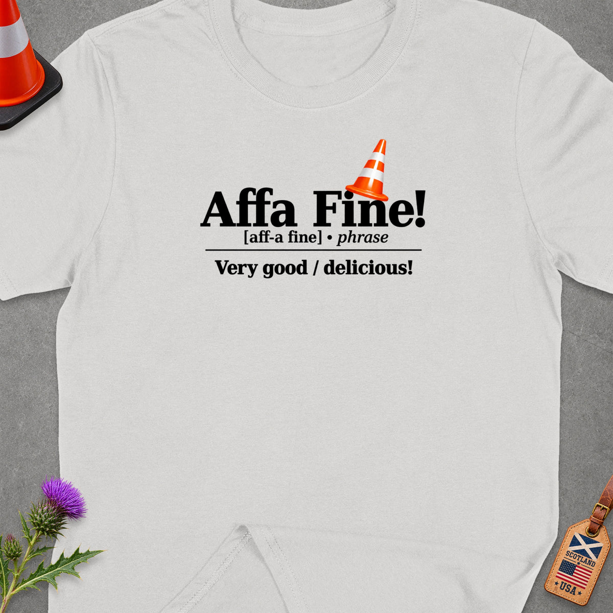 White t-shirt with "Affa Fine! Very good / delicious!" text and traffic cone graphic.