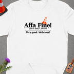 White t-shirt with "Affa Fine!" phrase and definition, traffic cone.
