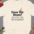 Cream t-shirt with "Foos Yer Doos? How are you getting on?" in black text.