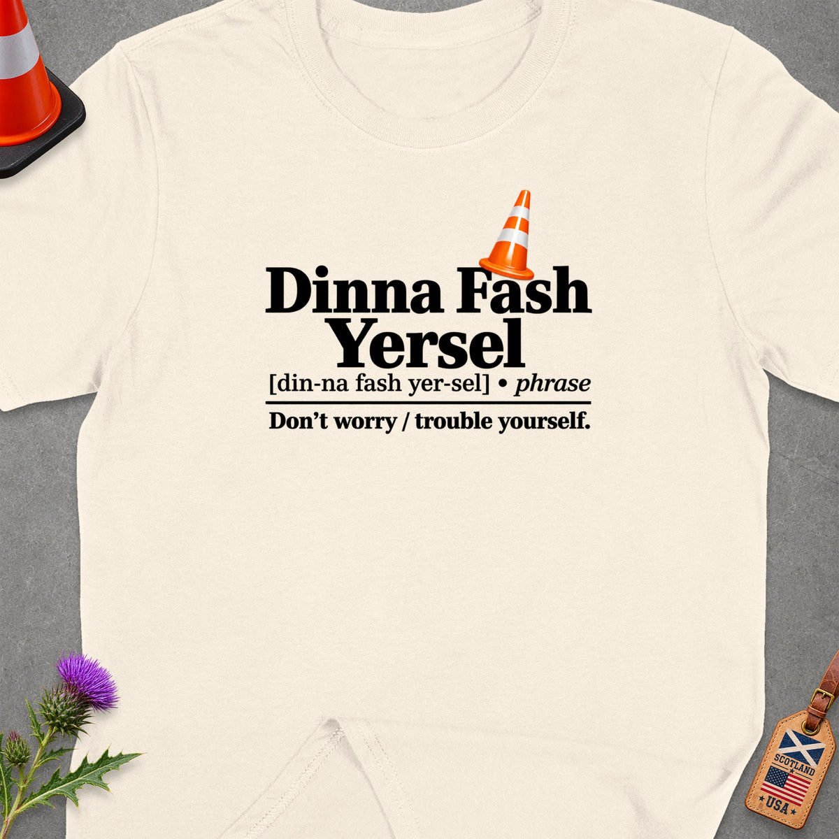 Cream t-shirt with "Dinna Fash Yersel" phrase and definition.