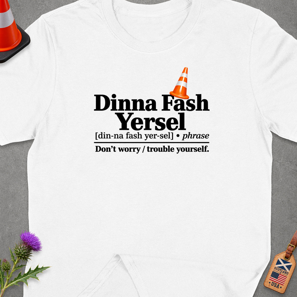 White t-shirt with "Dinna Fash Yersel" definition and Scottish/USA tag.