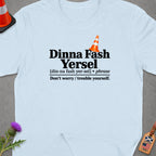Light blue t-shirt with "Dinna Fash Yersel" and definition.