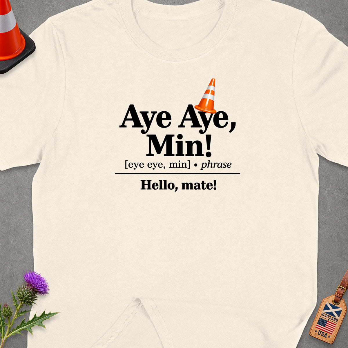 Cream t-shirt with text "Aye Aye, Min!" and "Hello, mate!".
