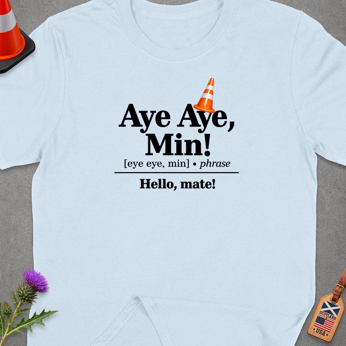 Light blue t-shirt with "Aye Aye, Min!" and "Hello, mate!" text.