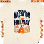 Orange traffic cone with US and UK flags, "You Say Vacation I Say Holiday" text.