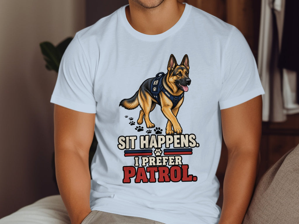 White t-shirt featuring a German Shepherd in a K9 vest and text reading "Sit Happens. I Prefer Patrol."