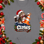 Cat in Santa hat with text "Santa Claws Nae Scotland, Nae Party."