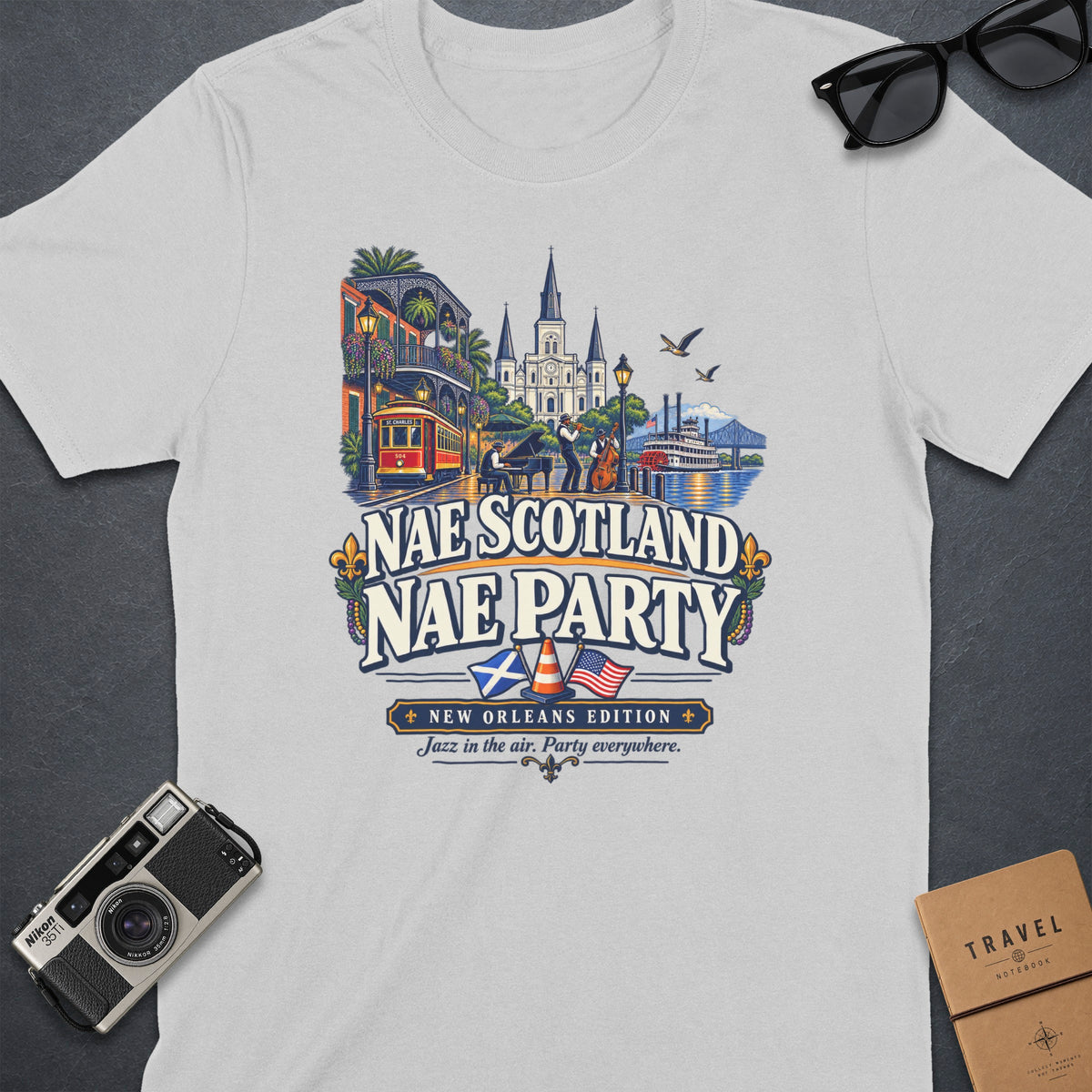 White t-shirt with "Nae Scotland Nae Party New Orleans Edition" graphic.
