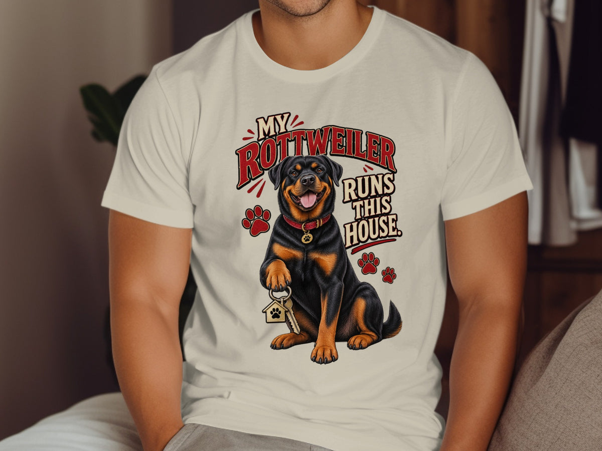Rottweiler on t-shirt holds house keys with paws. "My Rottweiler Runs This House" text.