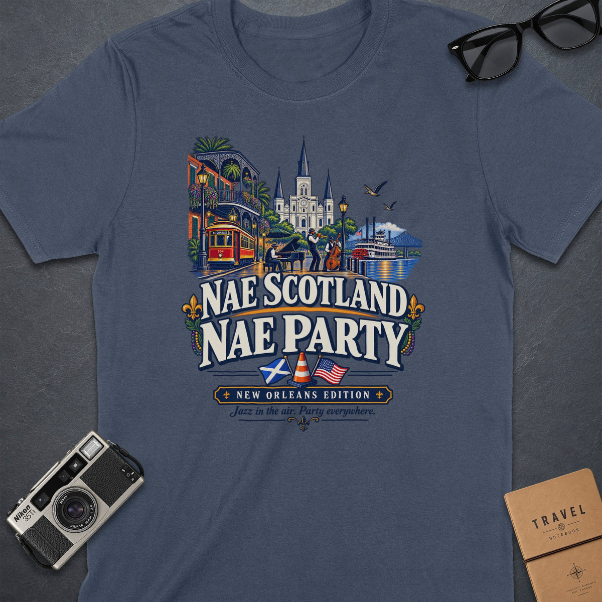 T-shirt with New Orleans scene, featuring "Nae Scotland Nae Party" and jazz band.