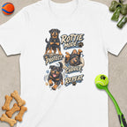 White t-shirt with four Rottweilers and text: "ROTTIE MODE: PROTECT. CUDDLE. REPEAT."