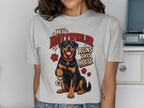 Rottweiler with keys and "My Rottweiler Runs This House" text on a light grey t-shirt.