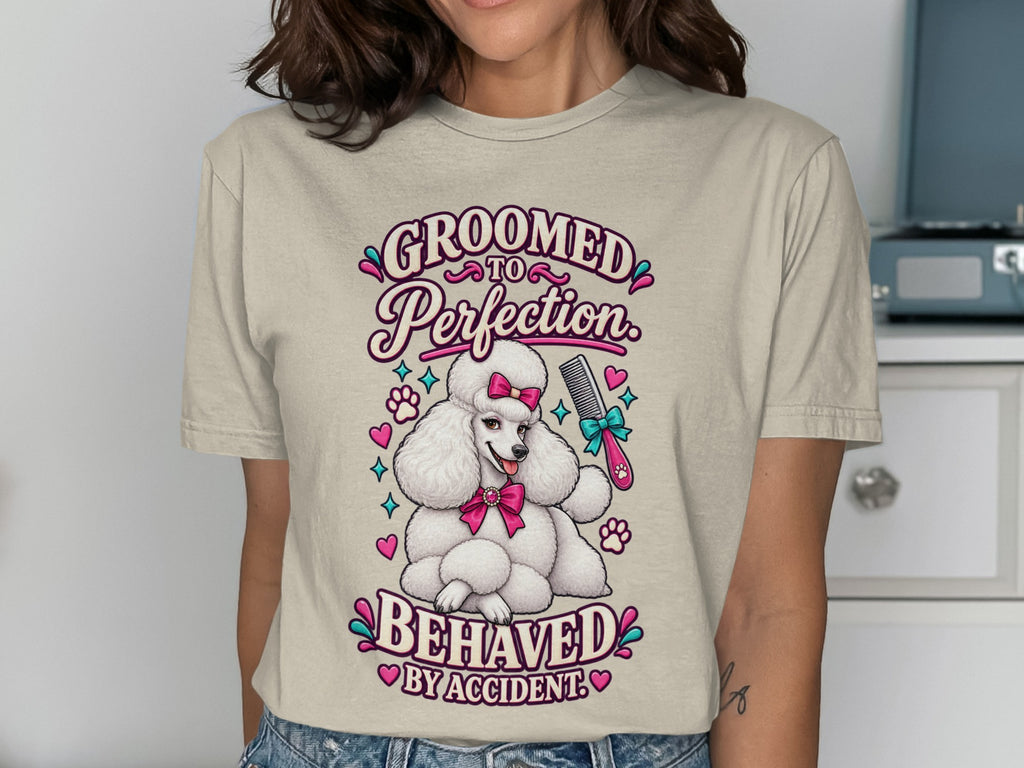 "Groomed to Perfection, Behaved by Accident" text with a white poodle and grooming tools.