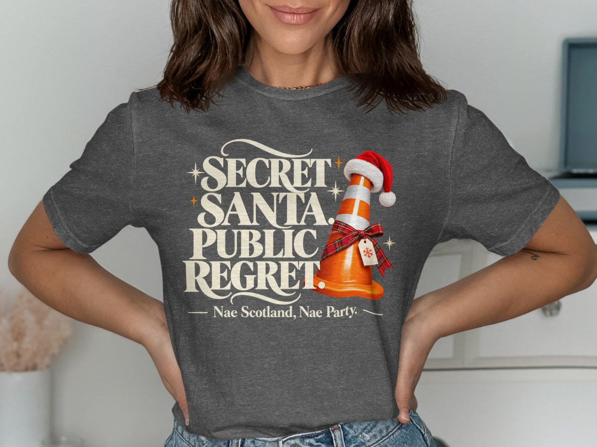 T-shirt with "Secret Santa, Public Regret" and a traffic cone wearing a Santa hat.