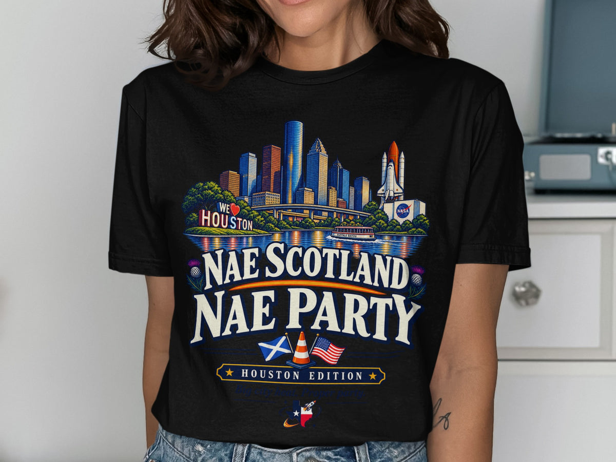 Black t-shirt graphic with Houston skyline, shuttle, and text "NAE SCOTLAND NAE PARTY HOUSTON EDITION".