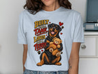 Rottweiler holding teddy bear with text "Built like a Tank. Loves like a Teddy."