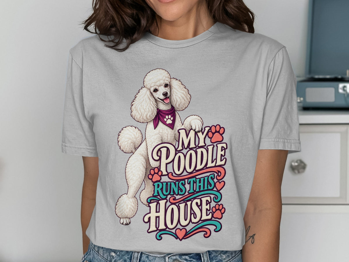 White poodle with bandana on t-shirt reading "My Poodle Runs This House".
