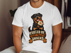 Rottweiler dog with a treat bag, text reads "Fueled by Loyalty & Snacks."