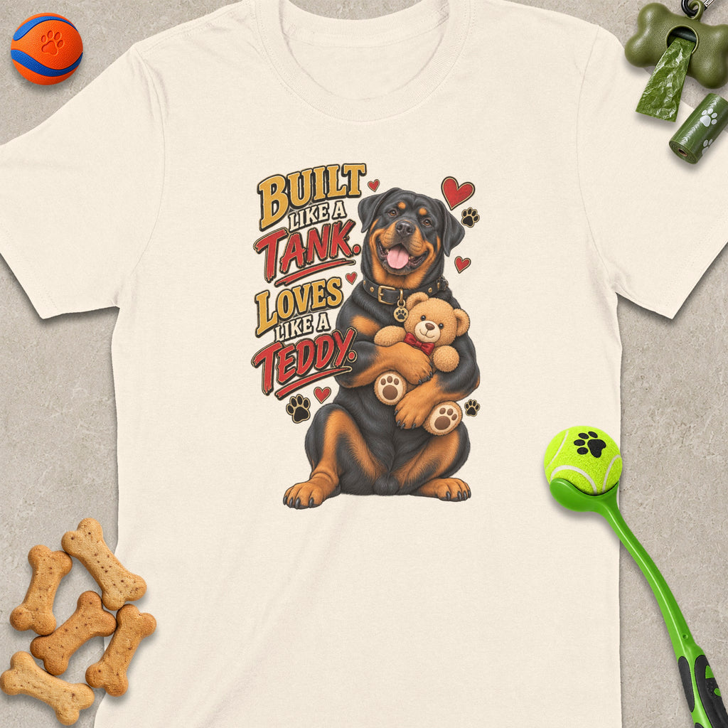 Rottweiler with teddy bear on shirt saying "Built Like a Tank, Loves Like a Teddy".